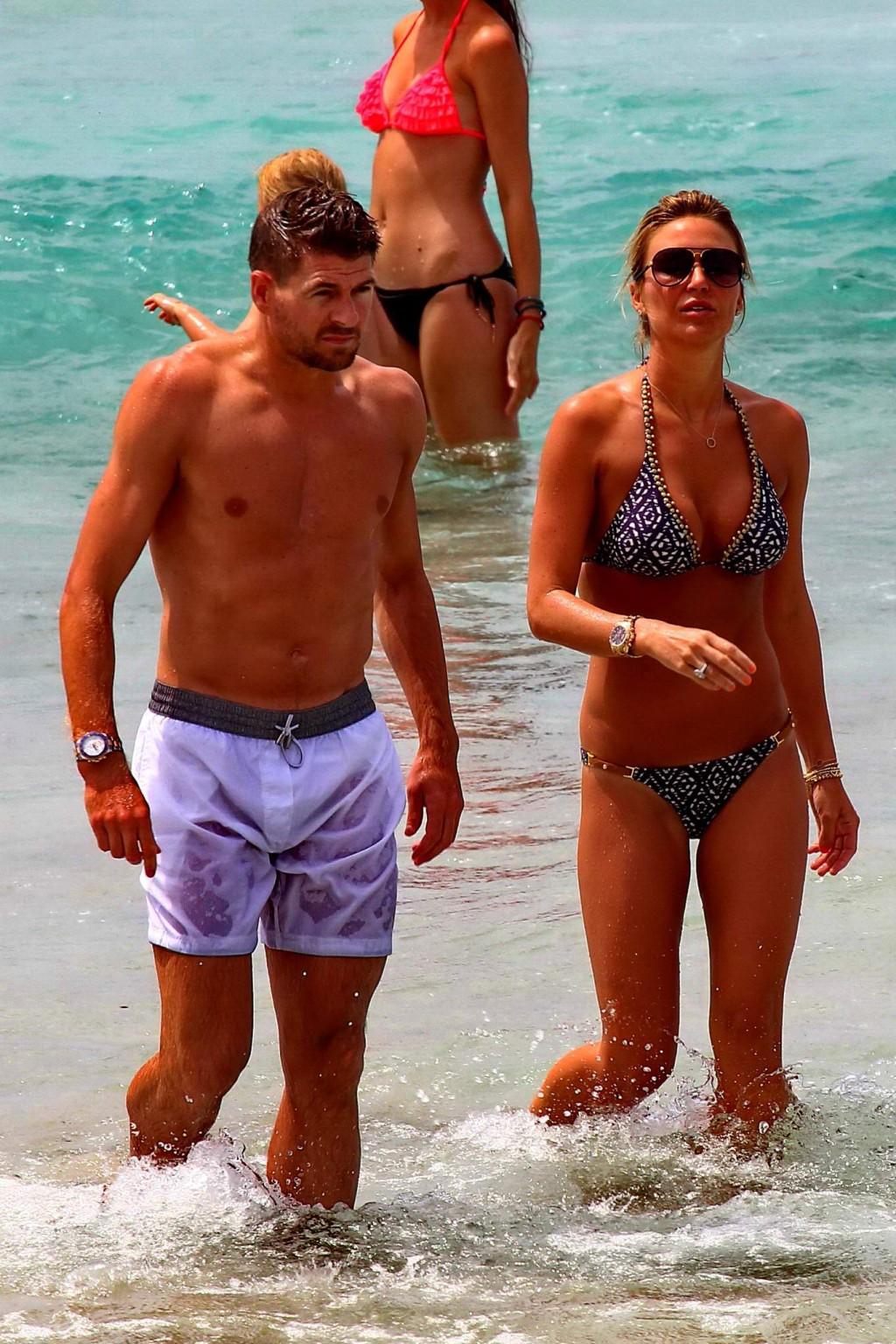16P Busty Alex Gerrard wearing a bikini on a beach in Ibiza