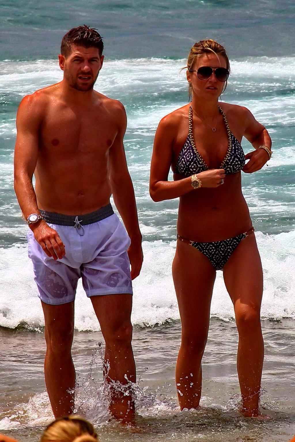 16P Busty Alex Gerrard wearing a bikini on a beach in Ibiza