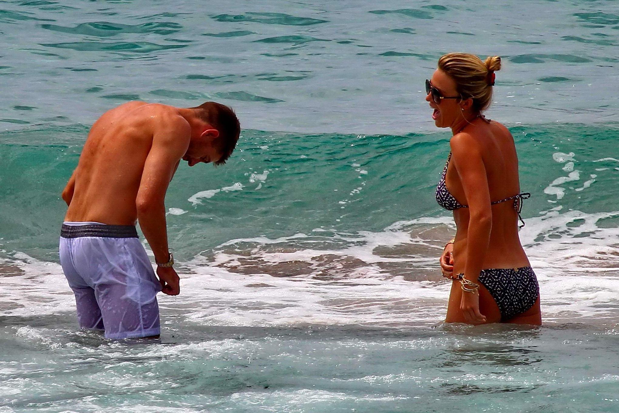 16P Busty Alex Gerrard wearing a bikini on a beach in Ibiza