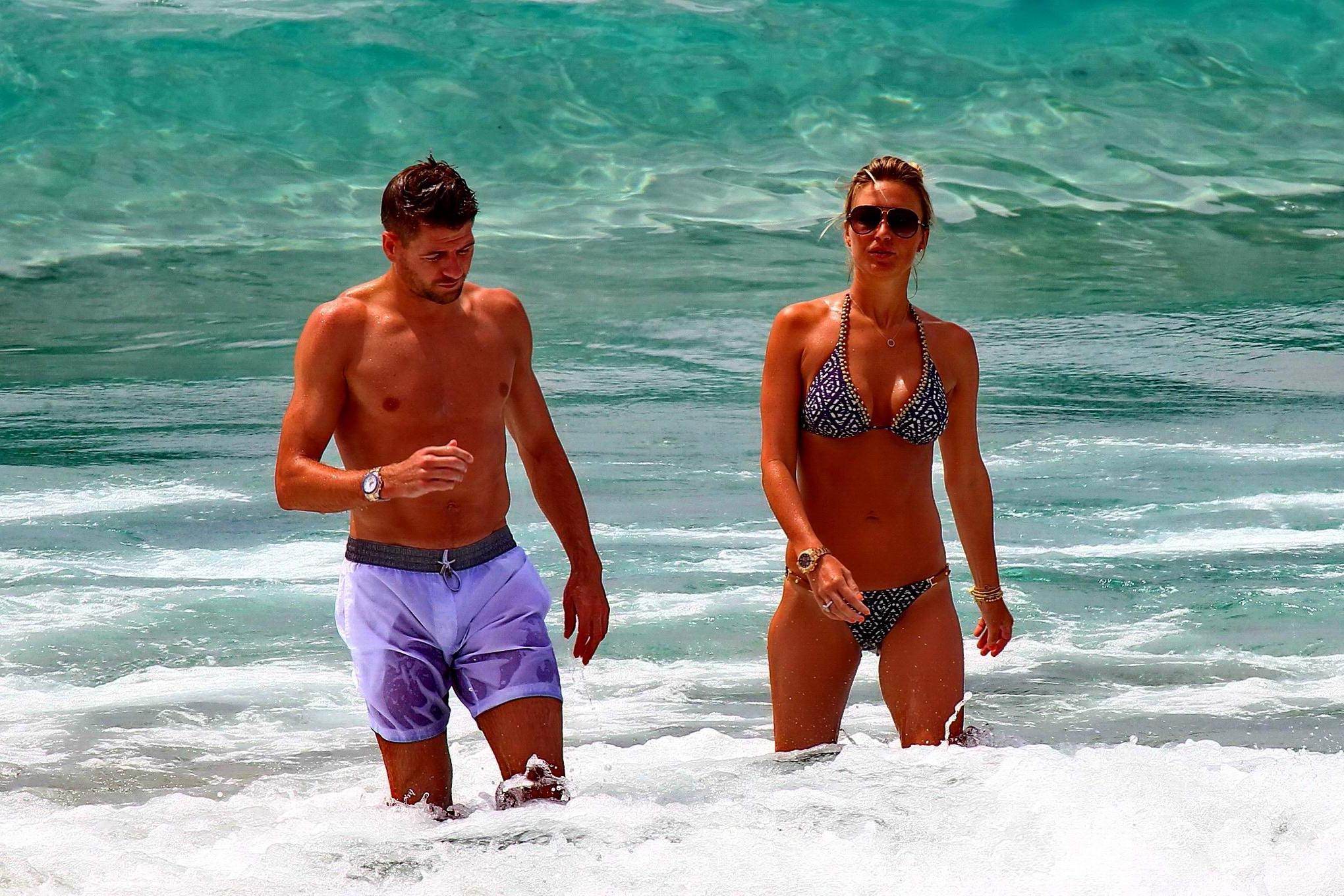 16P Busty Alex Gerrard wearing a bikini on a beach in Ibiza