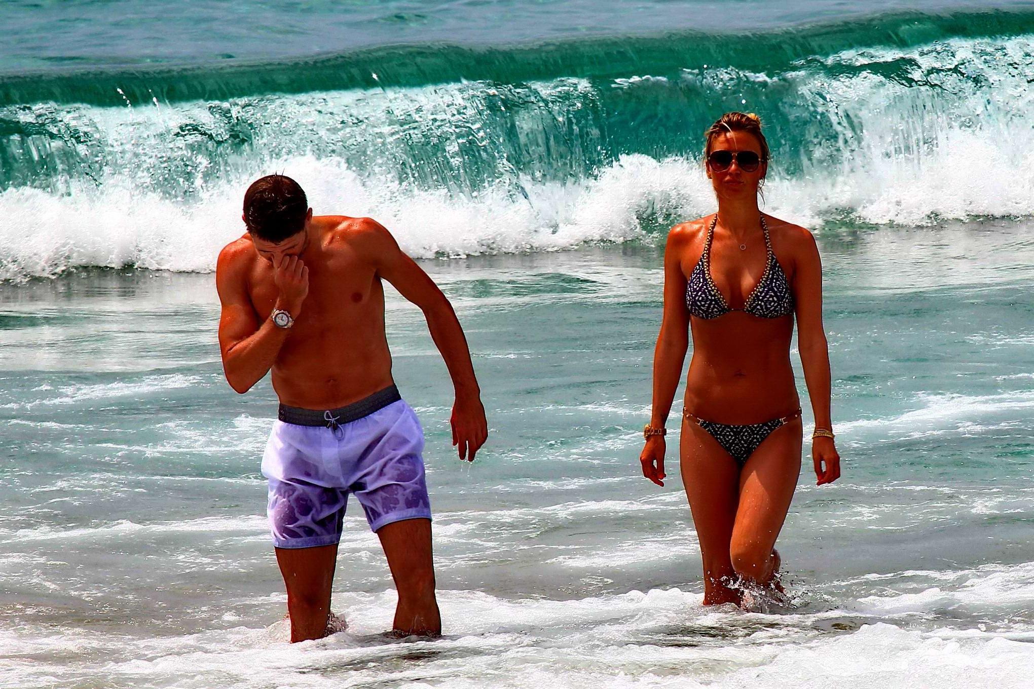 16P Busty Alex Gerrard wearing a bikini on a beach in Ibiza