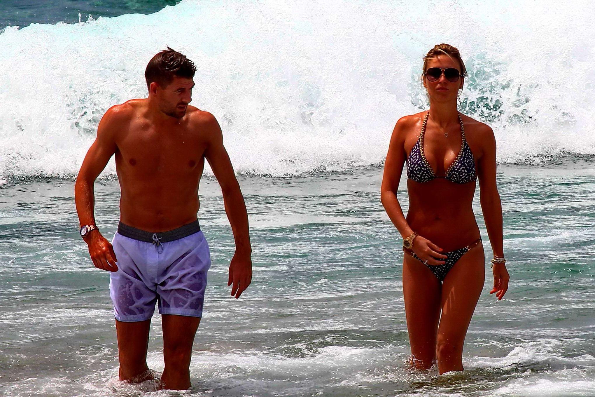 16P Busty Alex Gerrard wearing a bikini on a beach in Ibiza