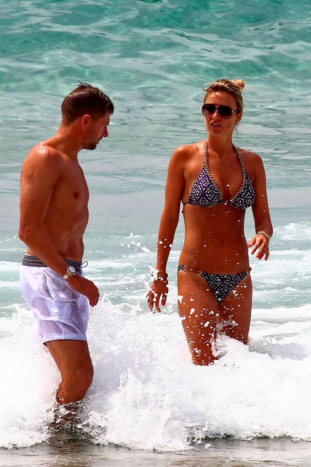 16P Busty Alex Gerrard wearing a bikini on a beach in Ibiza