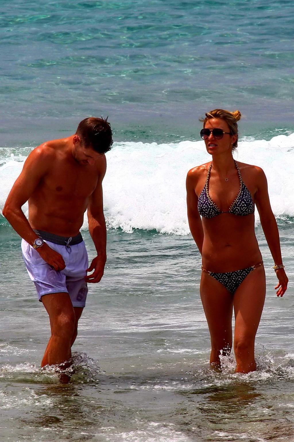16P Busty Alex Gerrard wearing a bikini on a beach in Ibiza