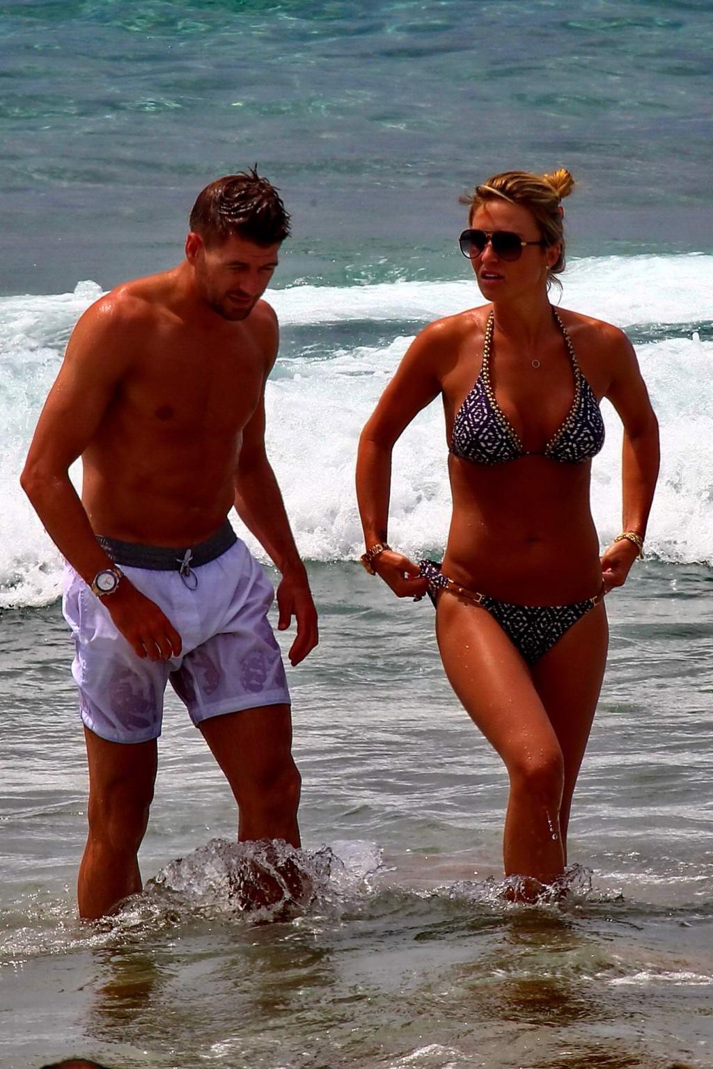 16P Busty Alex Gerrard wearing a bikini on a beach in Ibiza