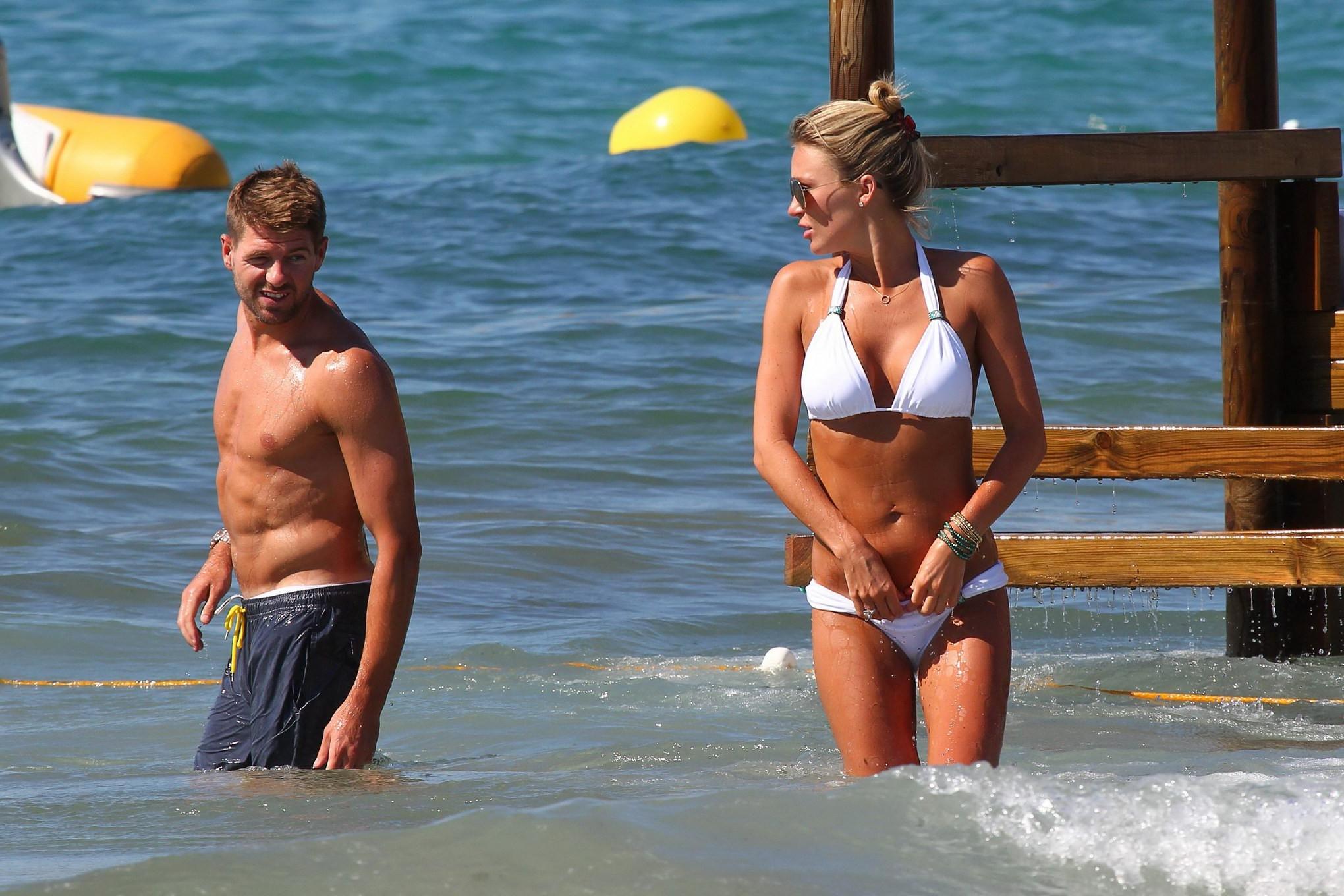 16P Alex Gerrard busty in skimpy white bikini with her husband at the beach in Ibiza