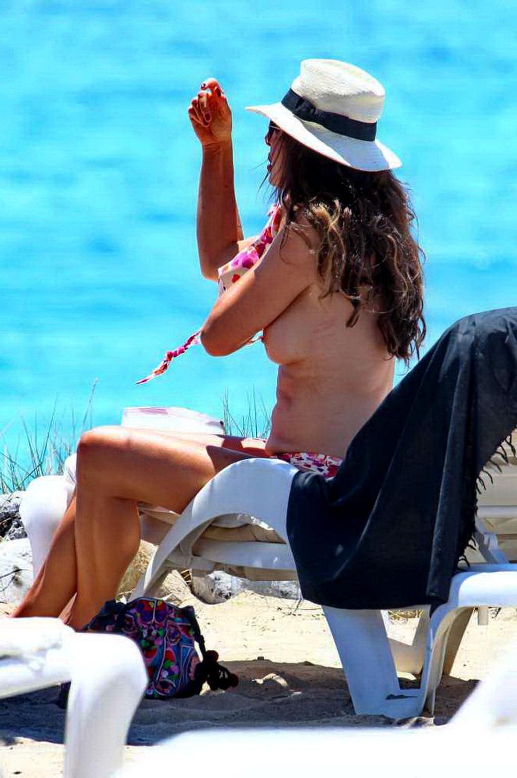 16P Alba Parietti topless showing off her big boobs on a beach in Ibiza