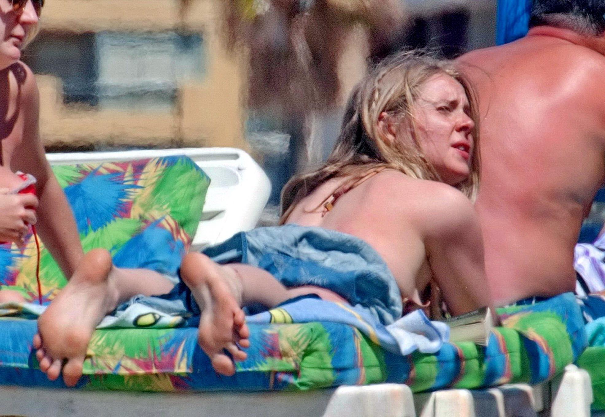 16P Diana Vickers wearing a wolf print bikini poolside in Spain