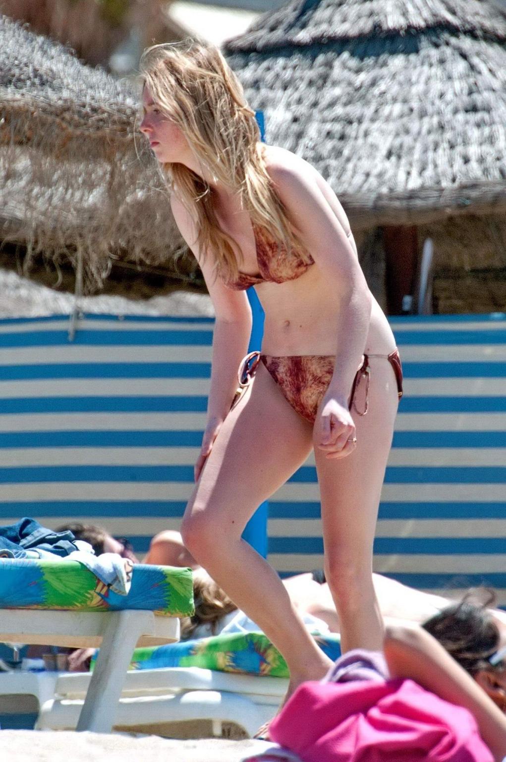 16P Diana Vickers wearing a wolf print bikini poolside in Spain