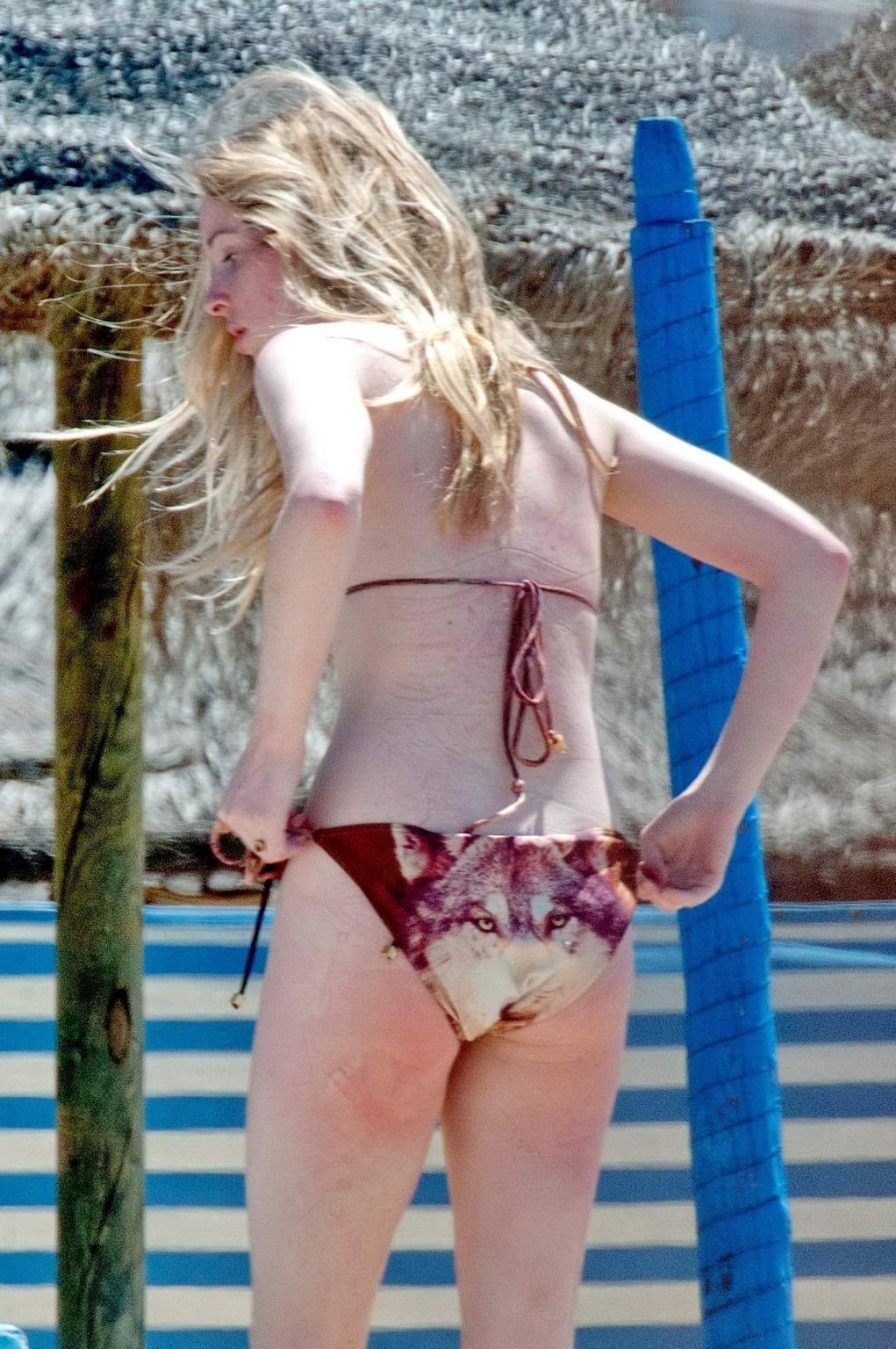 16P Diana Vickers wearing a wolf print bikini poolside in Spain