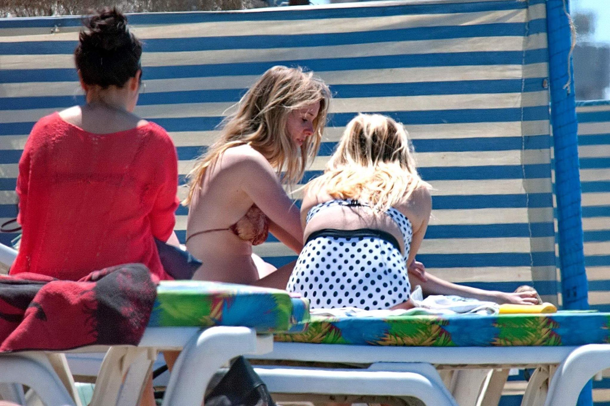 16P Diana Vickers wearing a wolf print bikini poolside in Spain