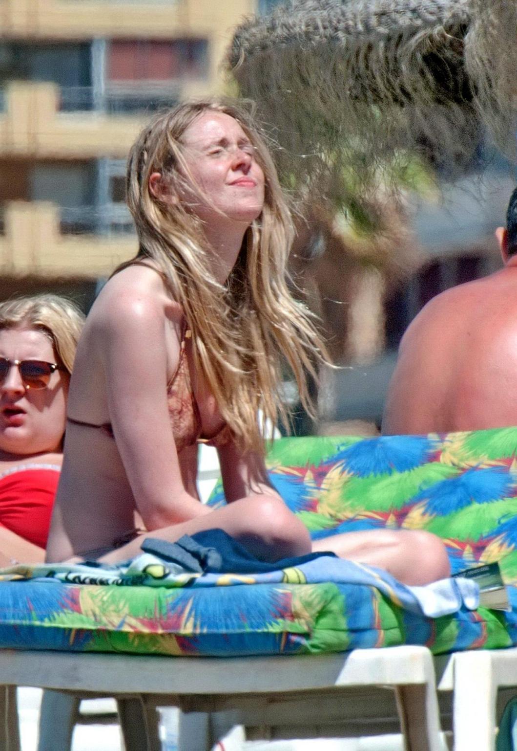 16P Diana Vickers wearing a wolf print bikini poolside in Spain