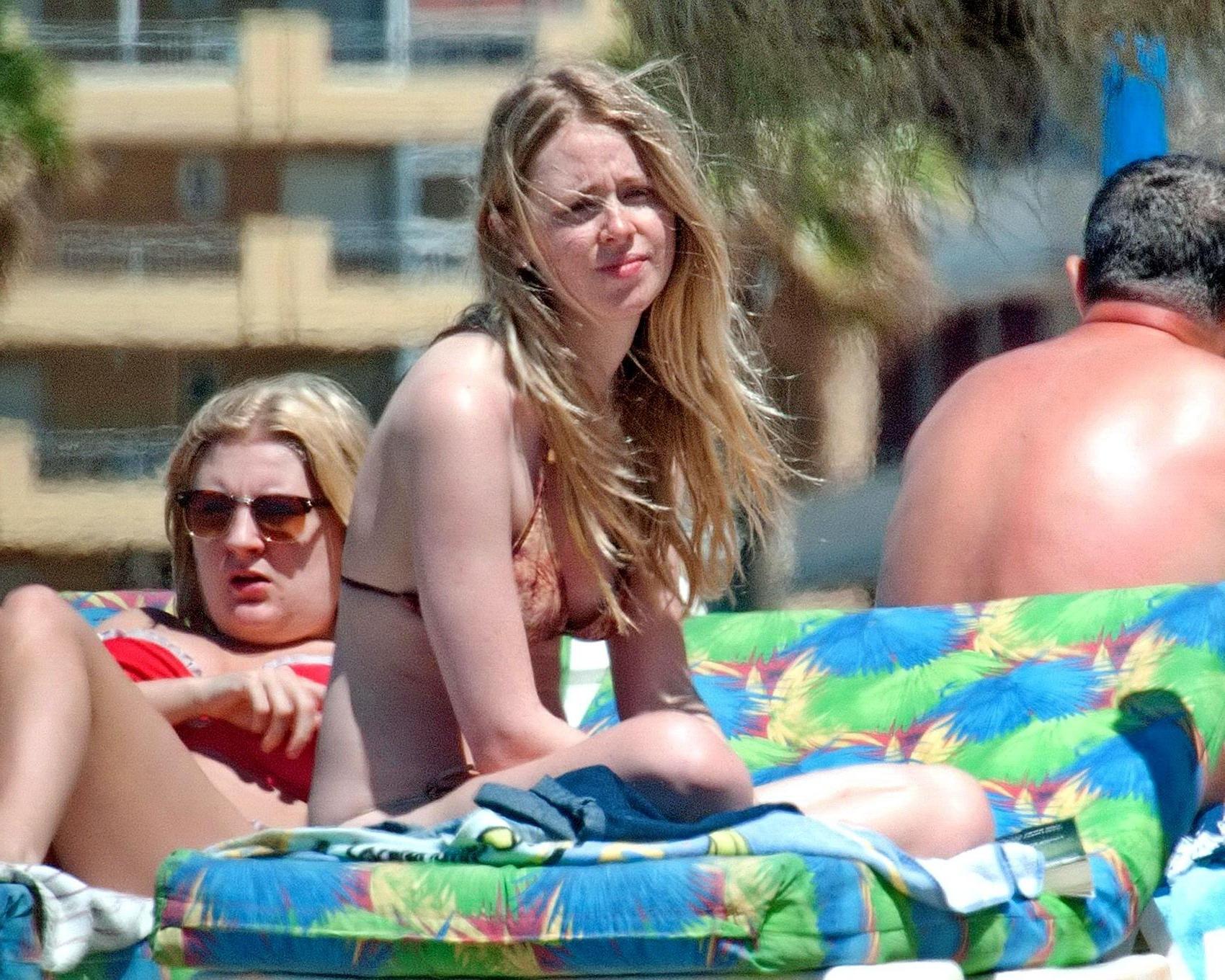16P Diana Vickers wearing a wolf print bikini poolside in Spain