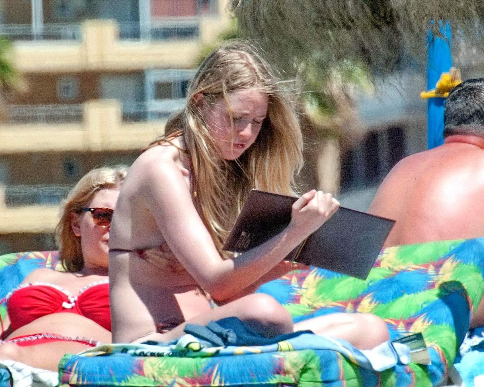 16P Diana Vickers wearing a wolf print bikini poolside in Spain