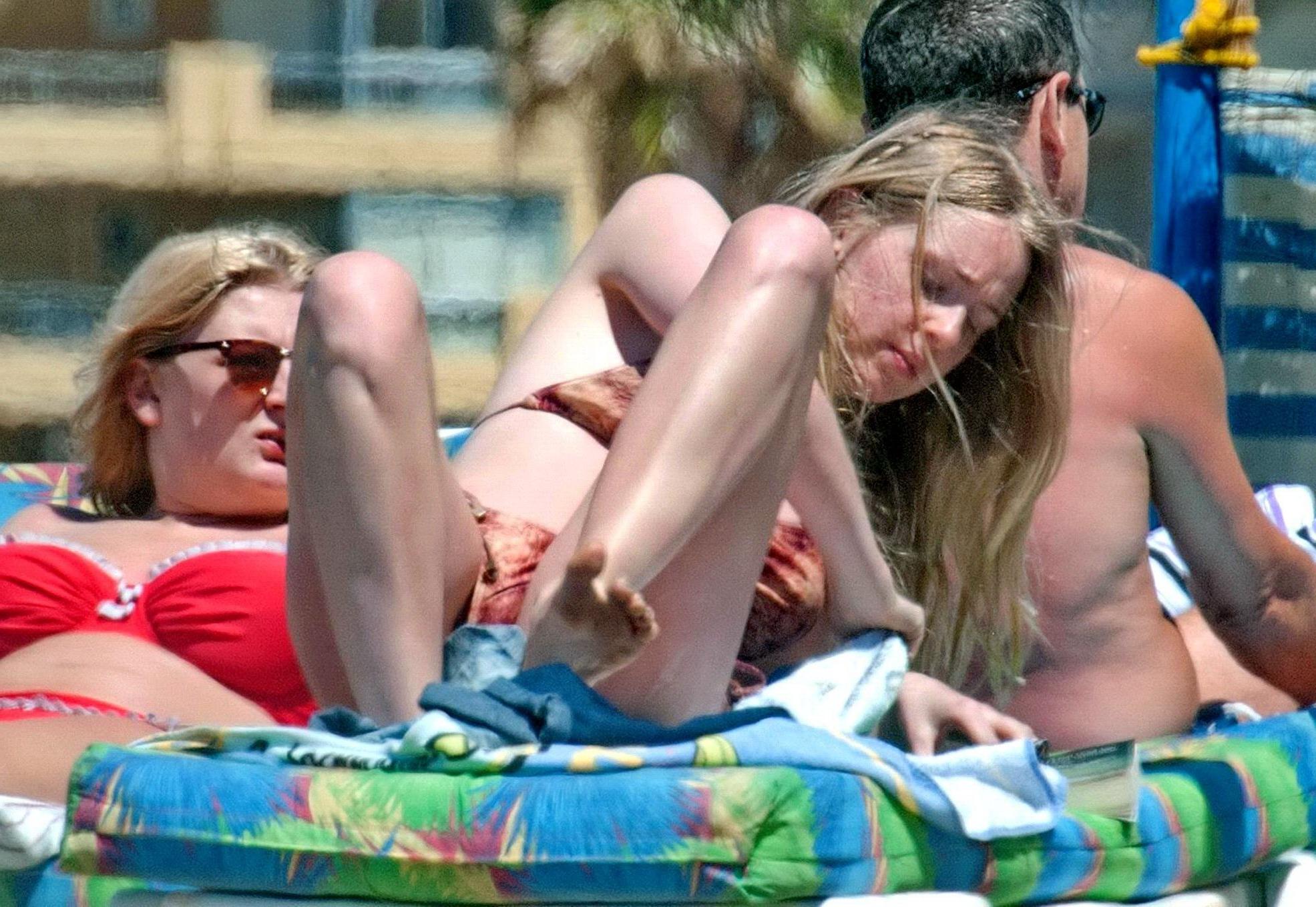 16P Diana Vickers wearing a wolf print bikini poolside in Spain