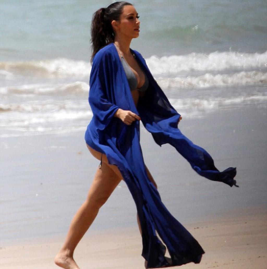 16P Kim Kardashian shows off huge bikini boobs and ass crack