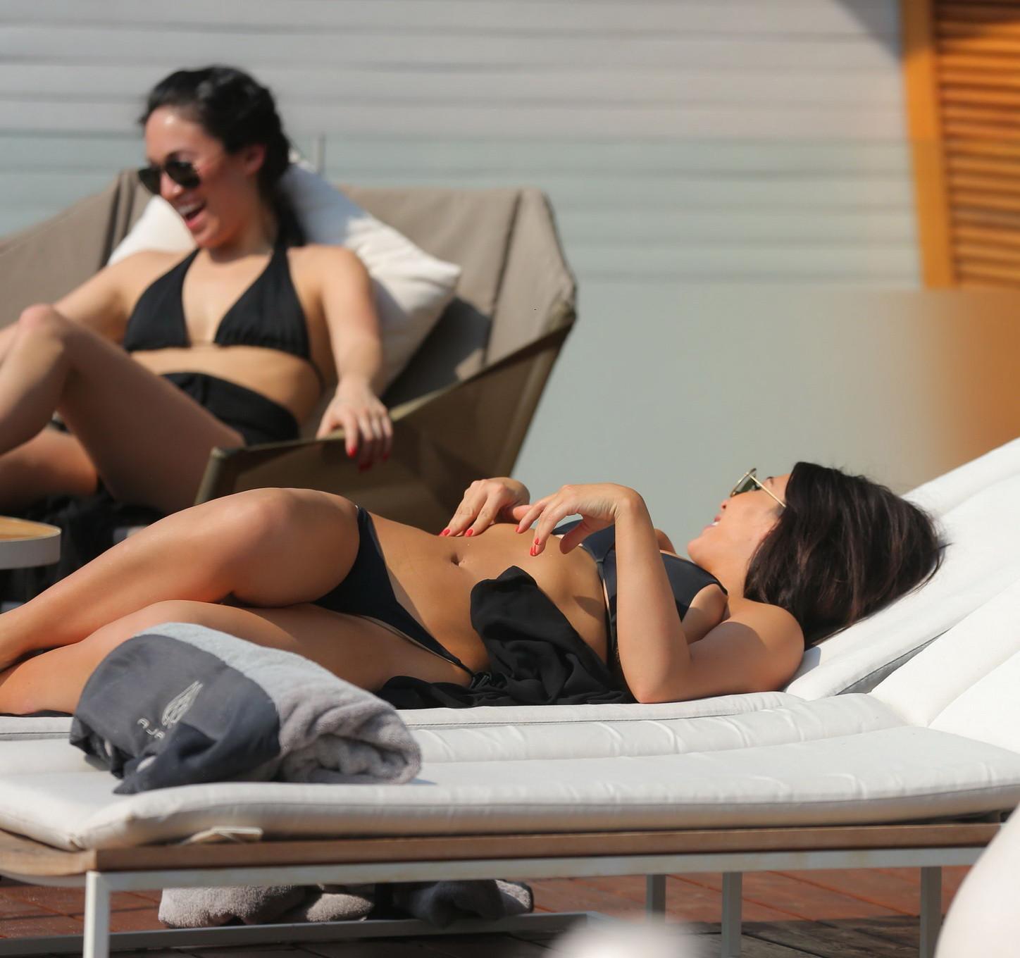 16P Kim Kardashian shows off huge bikini boobs and ass crack