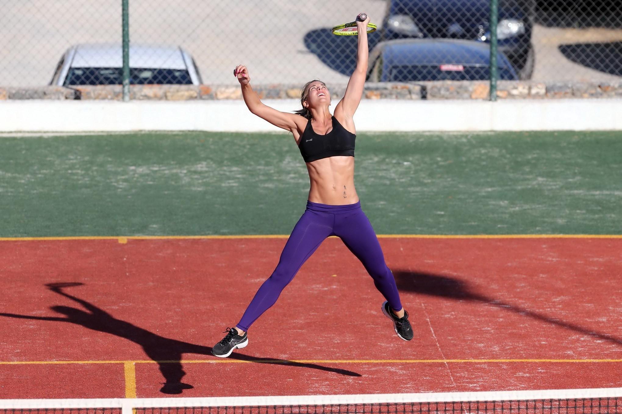 16P Gemma Atkinson in sports bra and tights playing tennis during a vacation in Gree