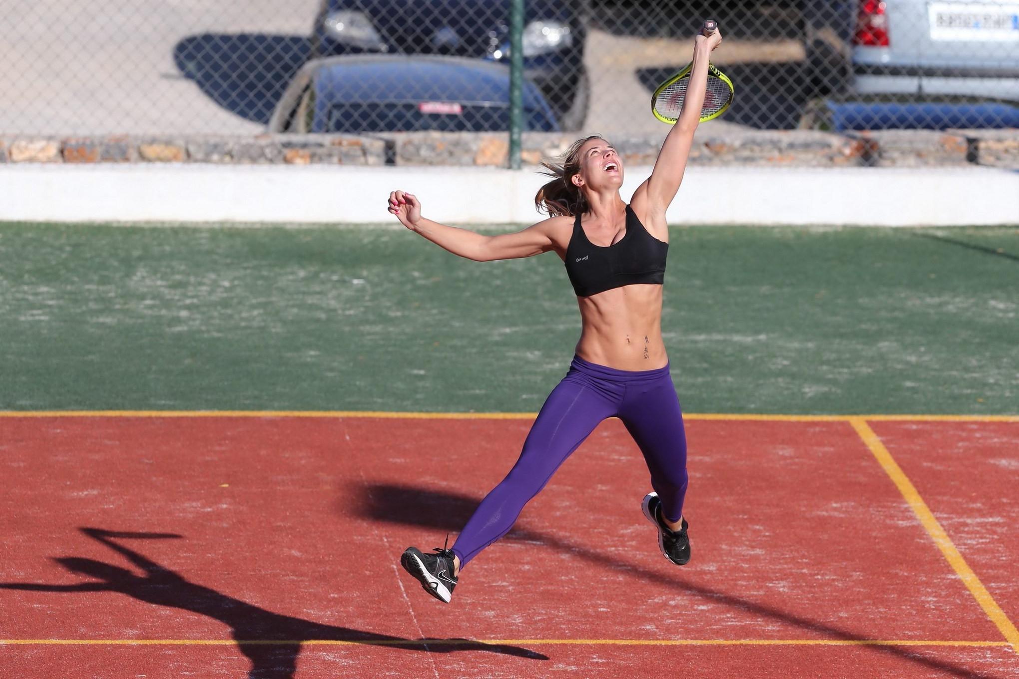 16P Gemma Atkinson in sports bra and tights playing tennis during a vacation in Gree