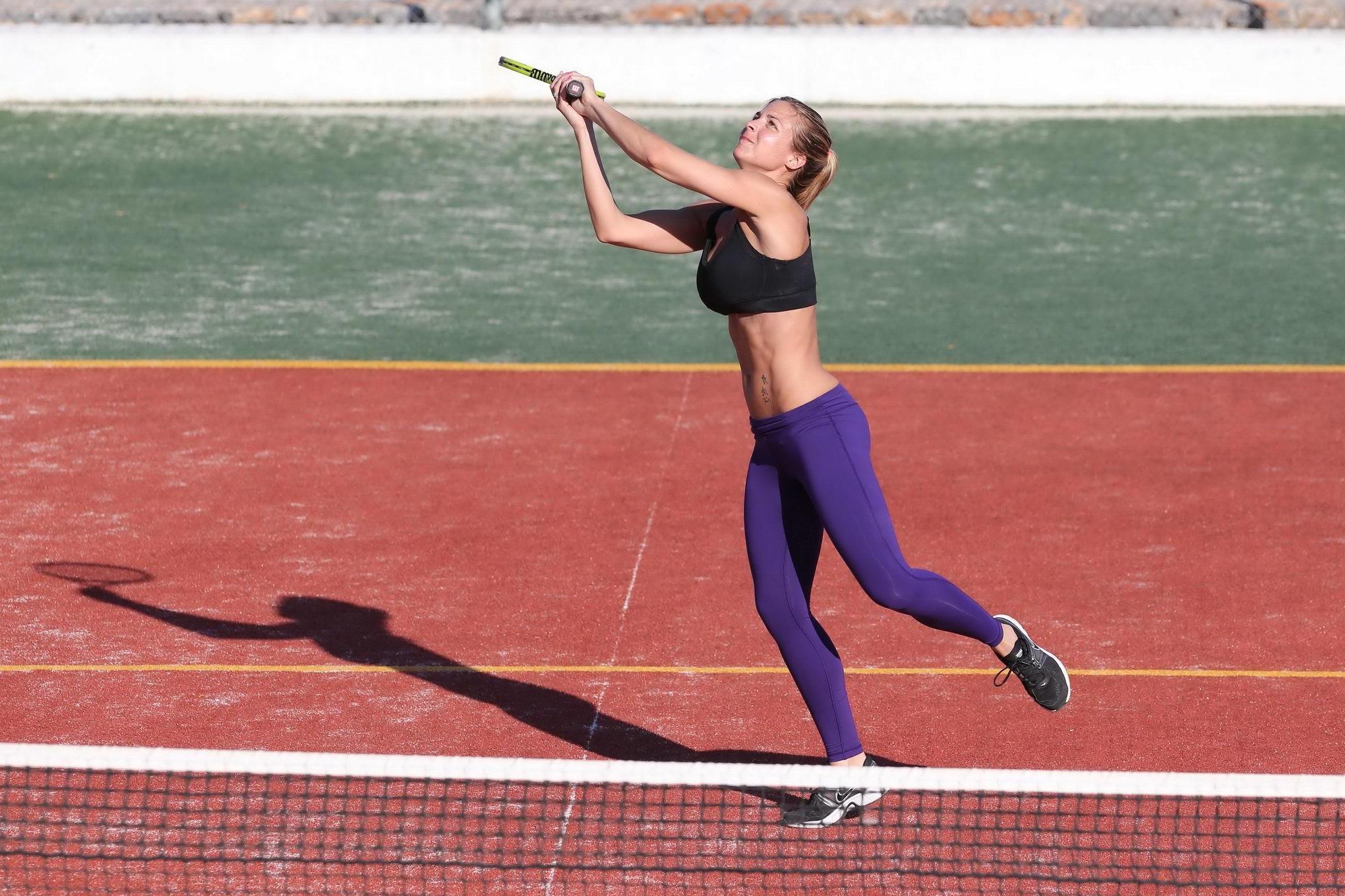 16P Gemma Atkinson in sports bra and tights playing tennis during a vacation in Gree