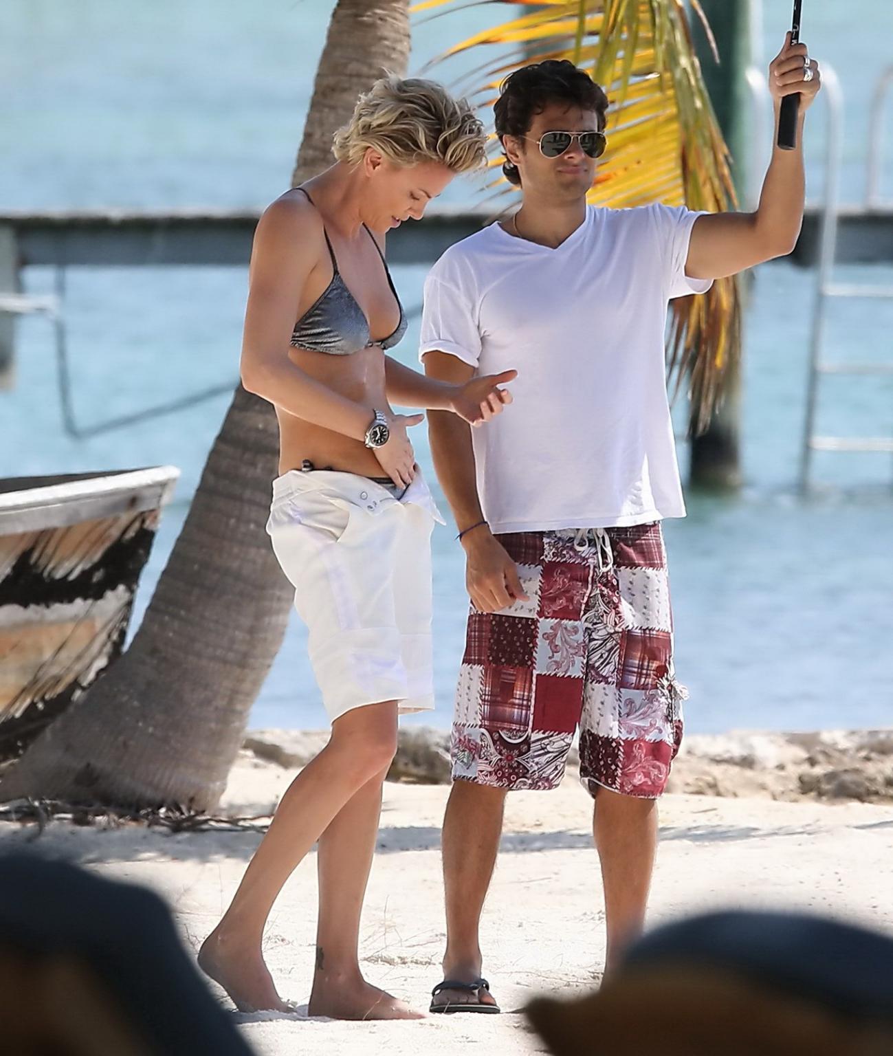 16P Charlize Theron showing off her hot bikini body while doing a sexy photoshoot in