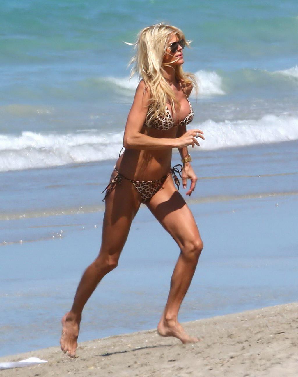 16P Victoria Silvstedt caught in a tiny leopard print bikini at the beach in Miami