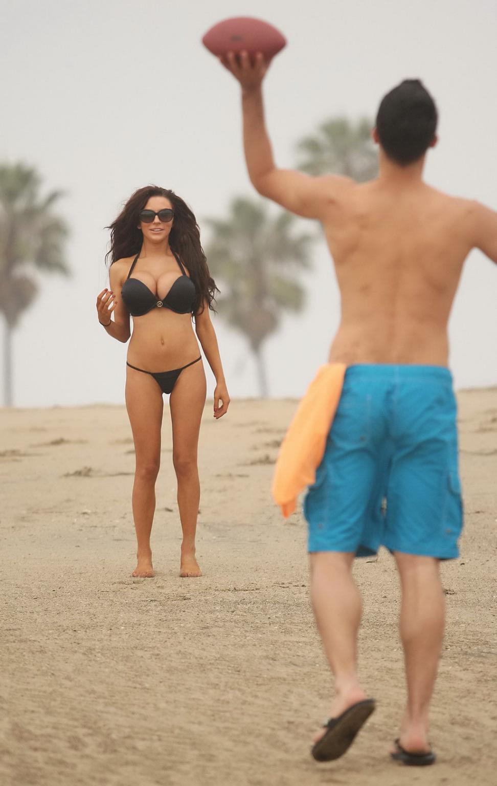 16P Courtney Stodden slips out her tiny black bikini while engaged in sports at LA B