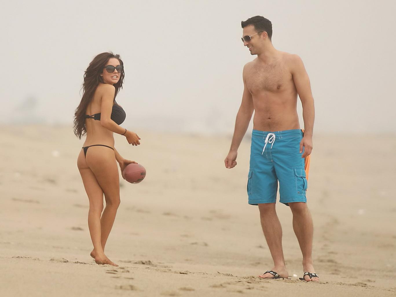 16P Courtney Stodden slips out her tiny black bikini while engaged in sports at LA B