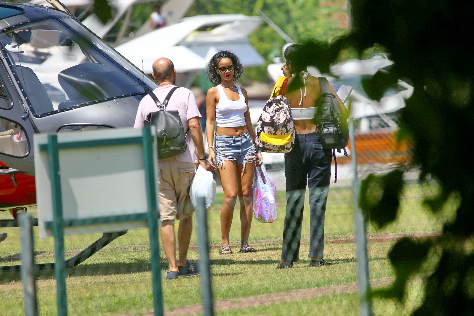 16P Rihanna showing off her boobs on the set of a photoshoot for Vogue Brasil in Ang