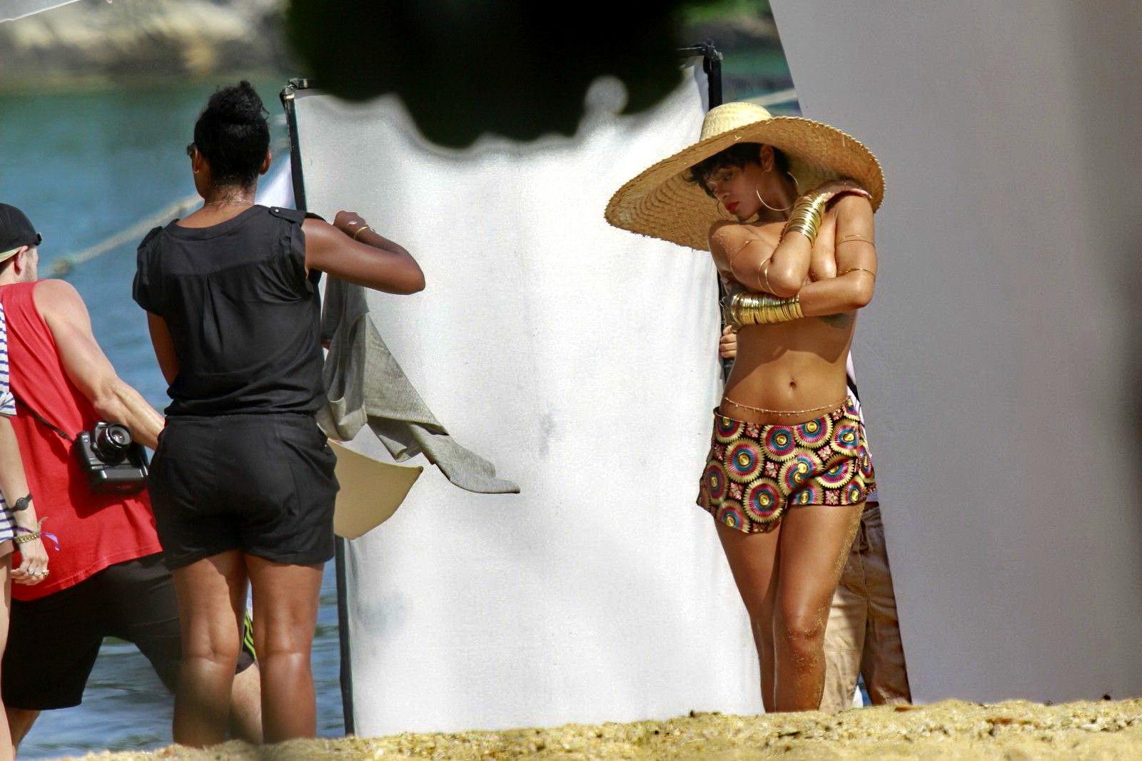 16P Rihanna showing off her boobs on the set of a photoshoot for Vogue Brasil in Ang