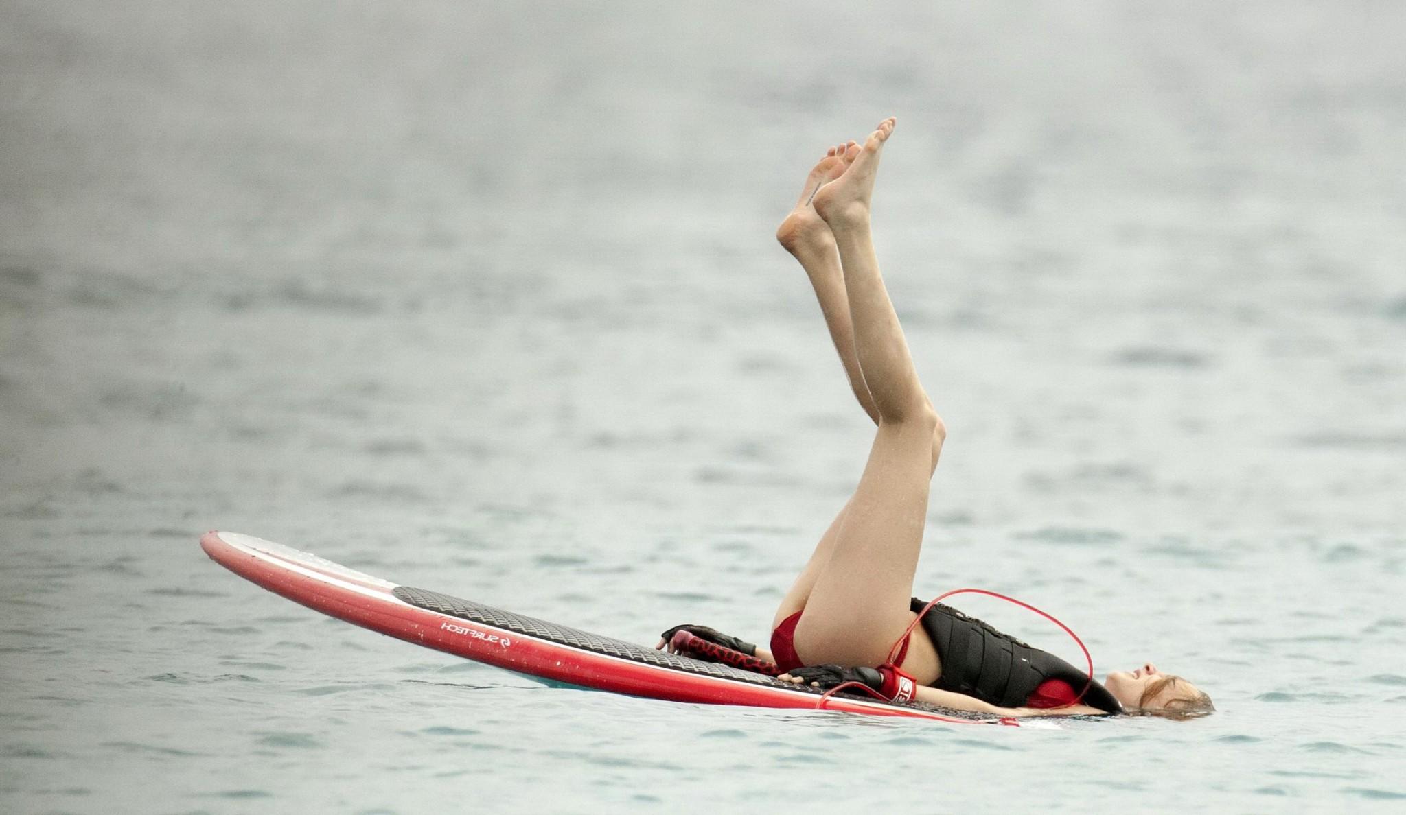 16P Cara Delevingne showing ass crack in red bikini at the beach in Barbados