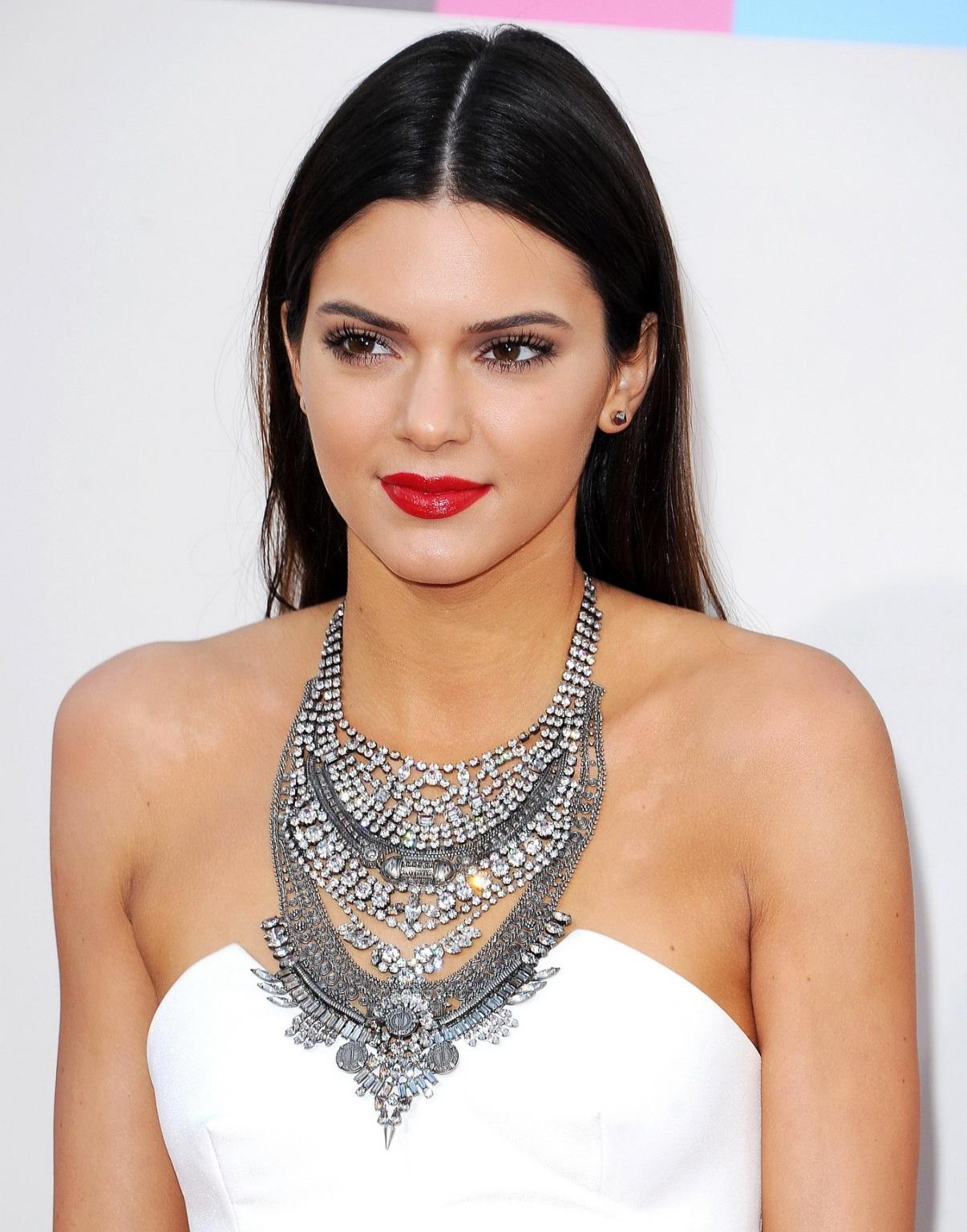 16P Kendall Jenner wearing tiny white mini dress at 2013 American Music Awards in Lo