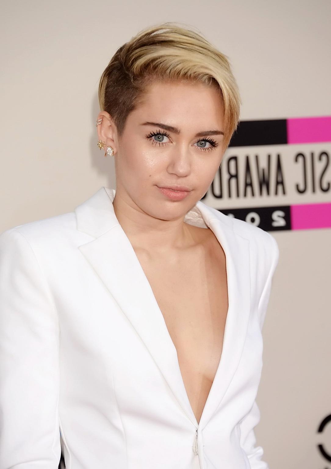 16P Miley Cyrus braless showing great cleavage in a white suit at 2013 American Musi