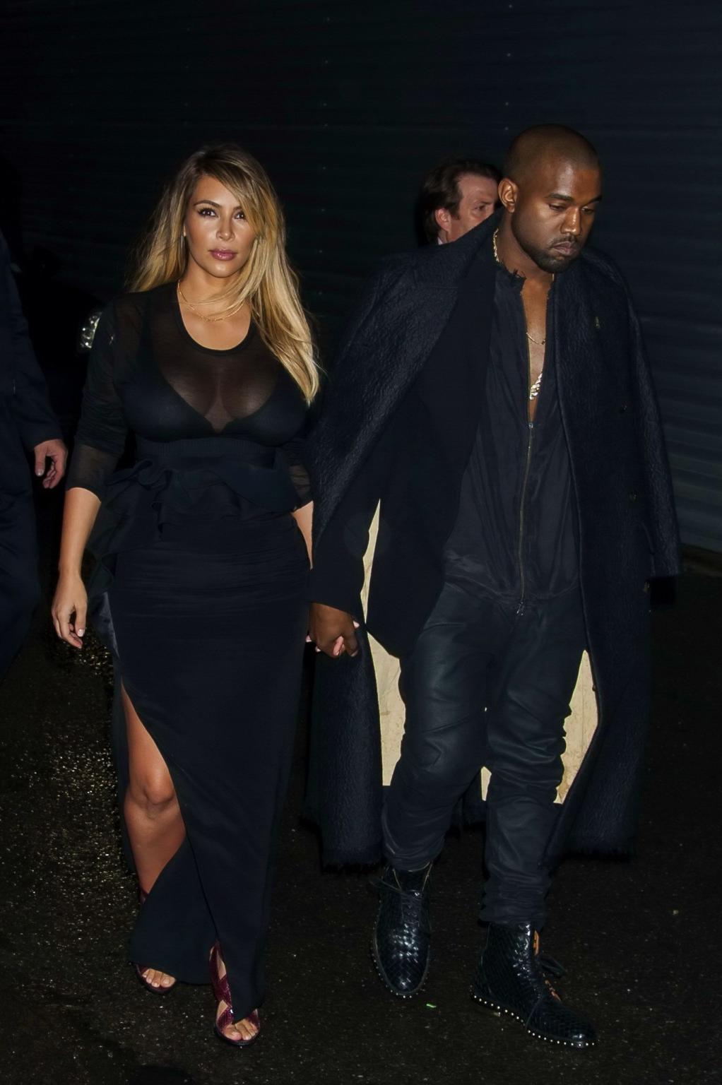 16P Kim Kardashian caught see-through to bra while leaving Givenchy Fashion Show in 