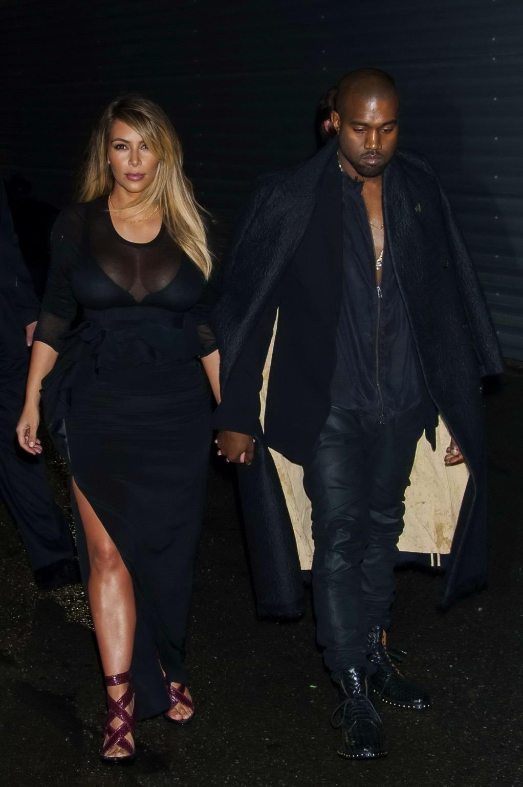 16P Kim Kardashian caught see-through to bra while leaving Givenchy Fashion Show in 