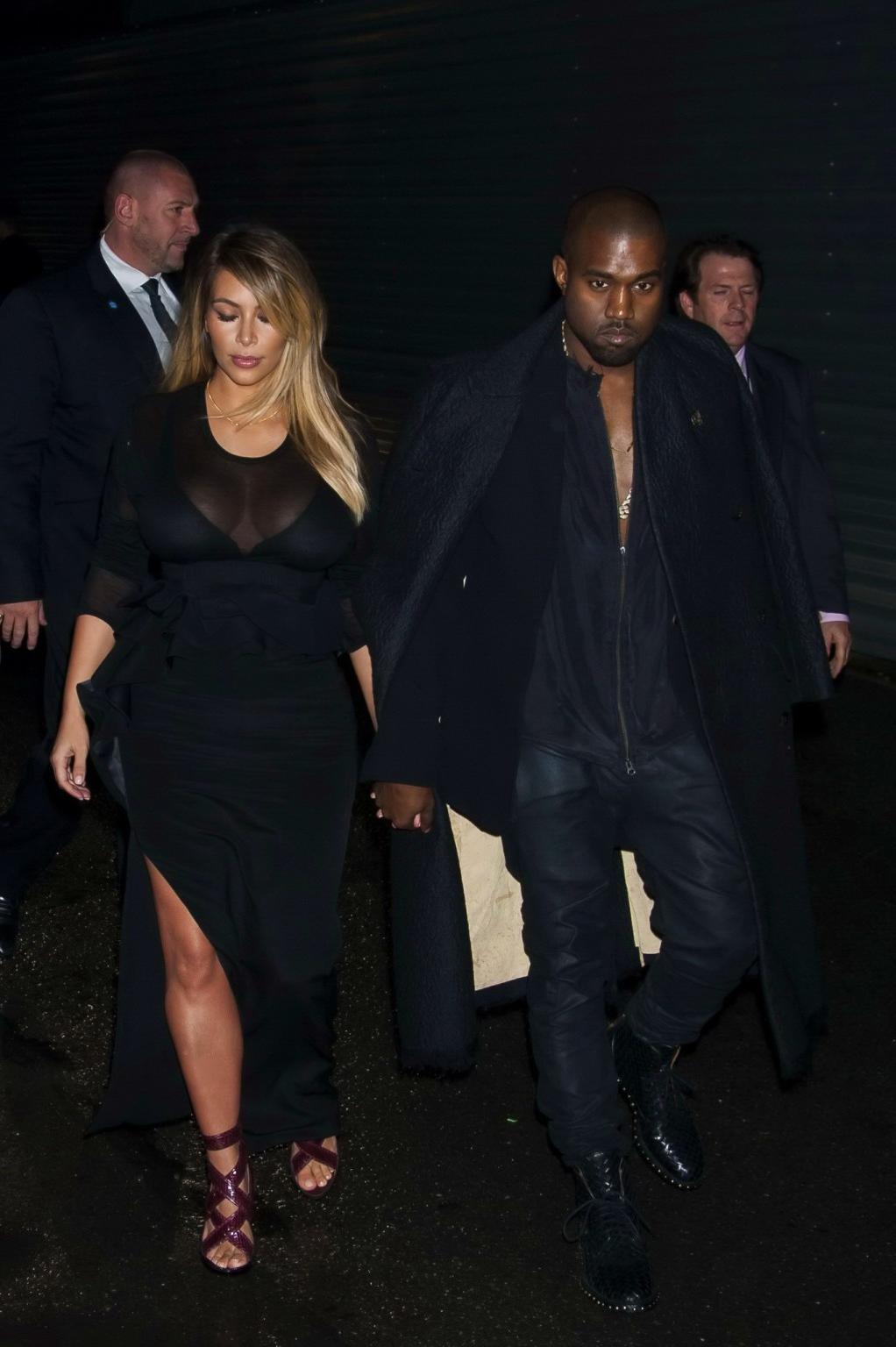 16P Kim Kardashian caught see-through to bra while leaving Givenchy Fashion Show in 