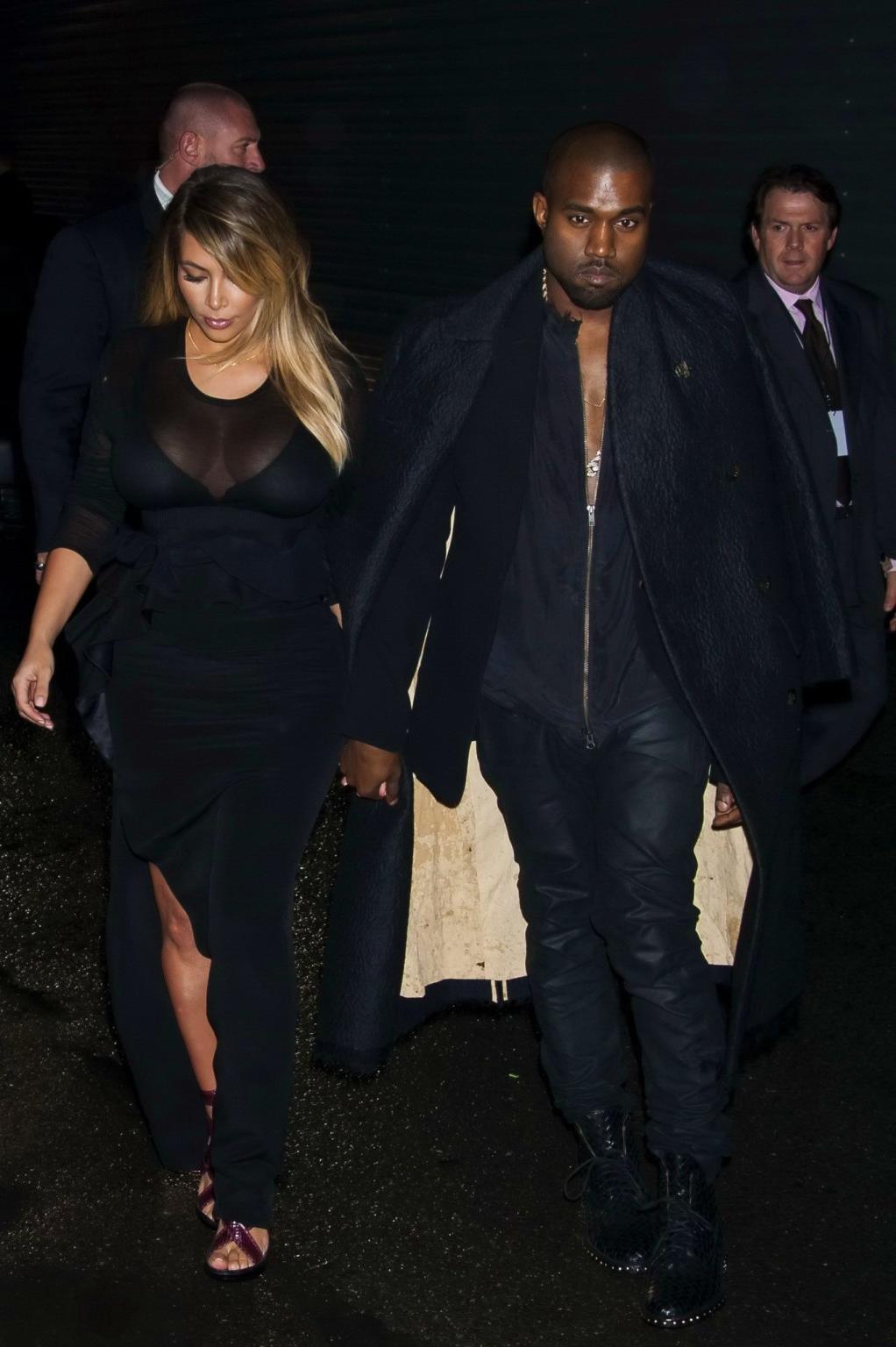 16P Kim Kardashian caught see-through to bra while leaving Givenchy Fashion Show in 