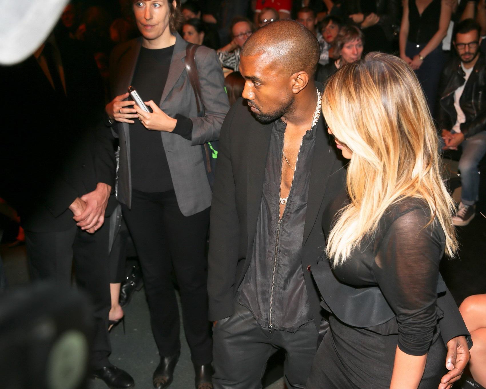 16P Kim Kardashian caught see-through to bra while leaving Givenchy Fashion Show in 