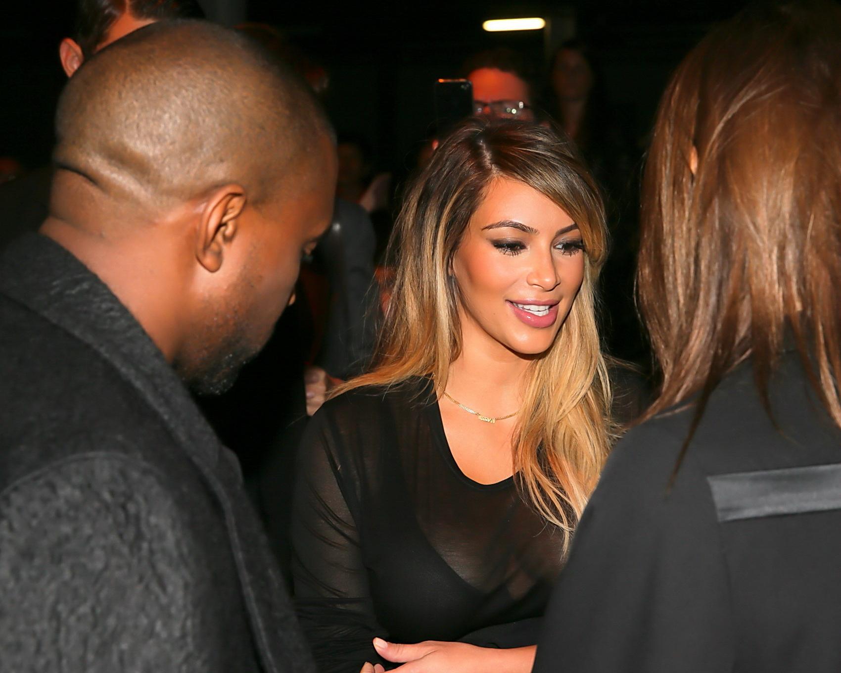 16P Kim Kardashian caught see-through to bra while leaving Givenchy Fashion Show in 