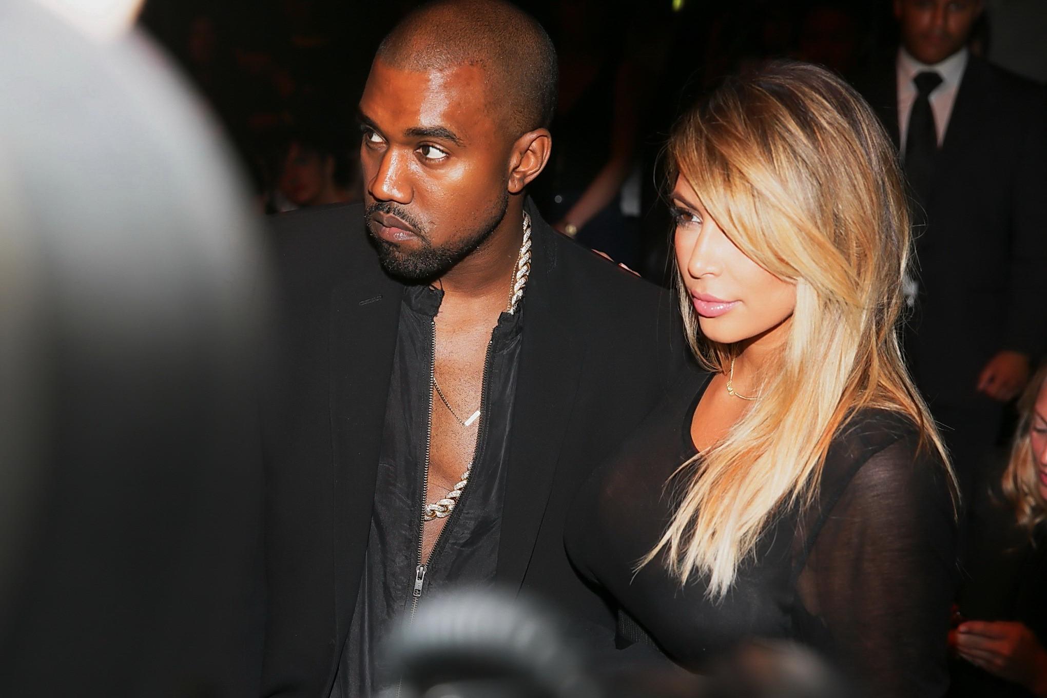 16P Kim Kardashian caught see-through to bra while leaving Givenchy Fashion Show in 