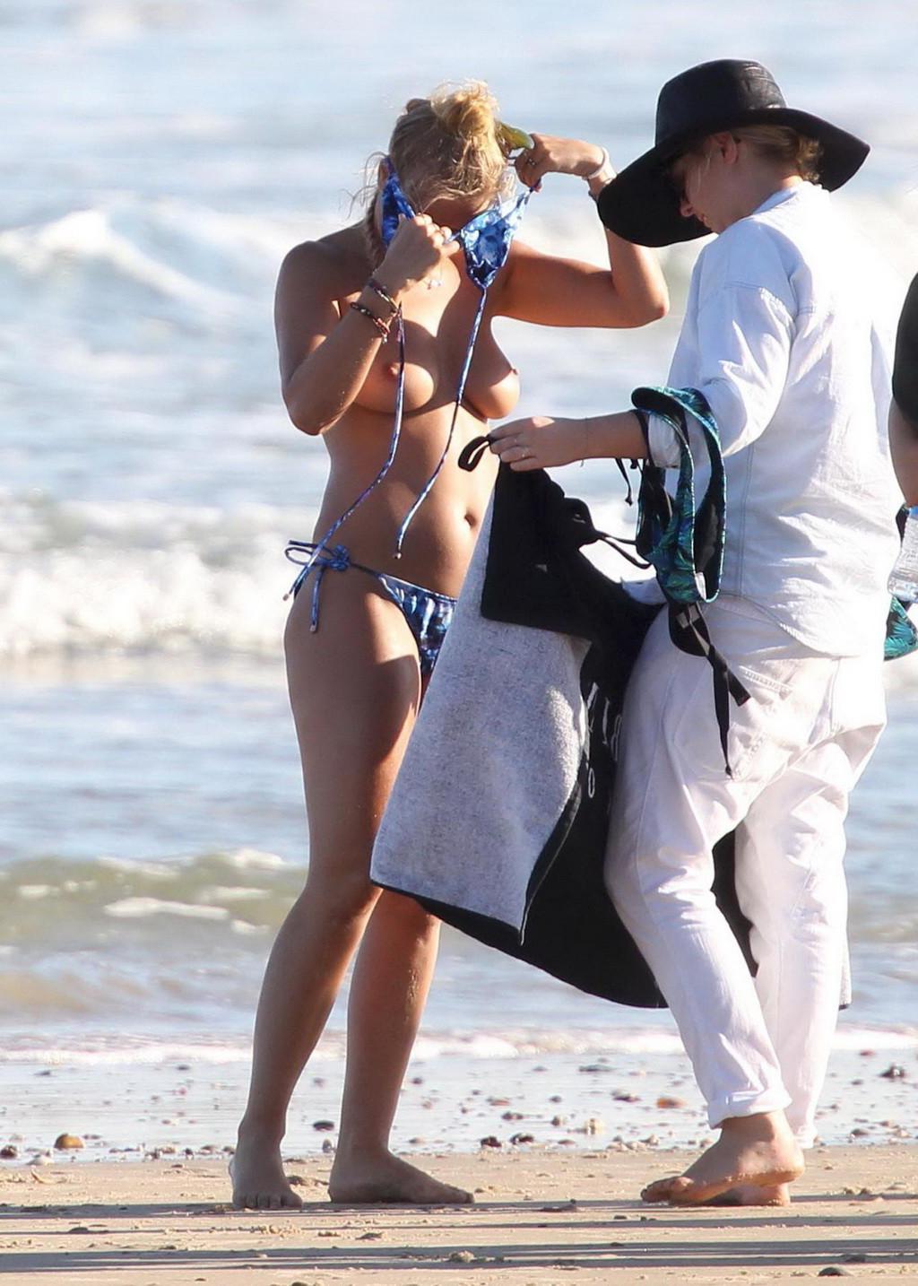 16P Lara Bingle showing off her big bare boobs during a bikini photoshoot at some be