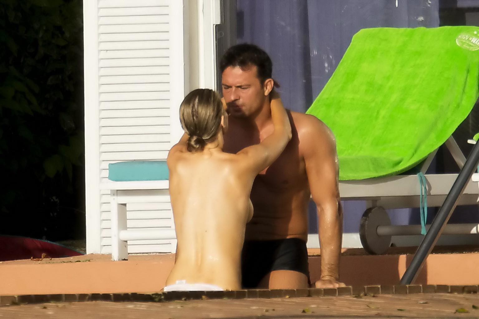 16P Joanna Krupa caught topless at the pool in Miami