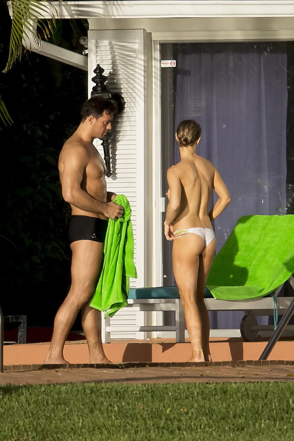 16P Joanna Krupa caught topless at the pool in Miami