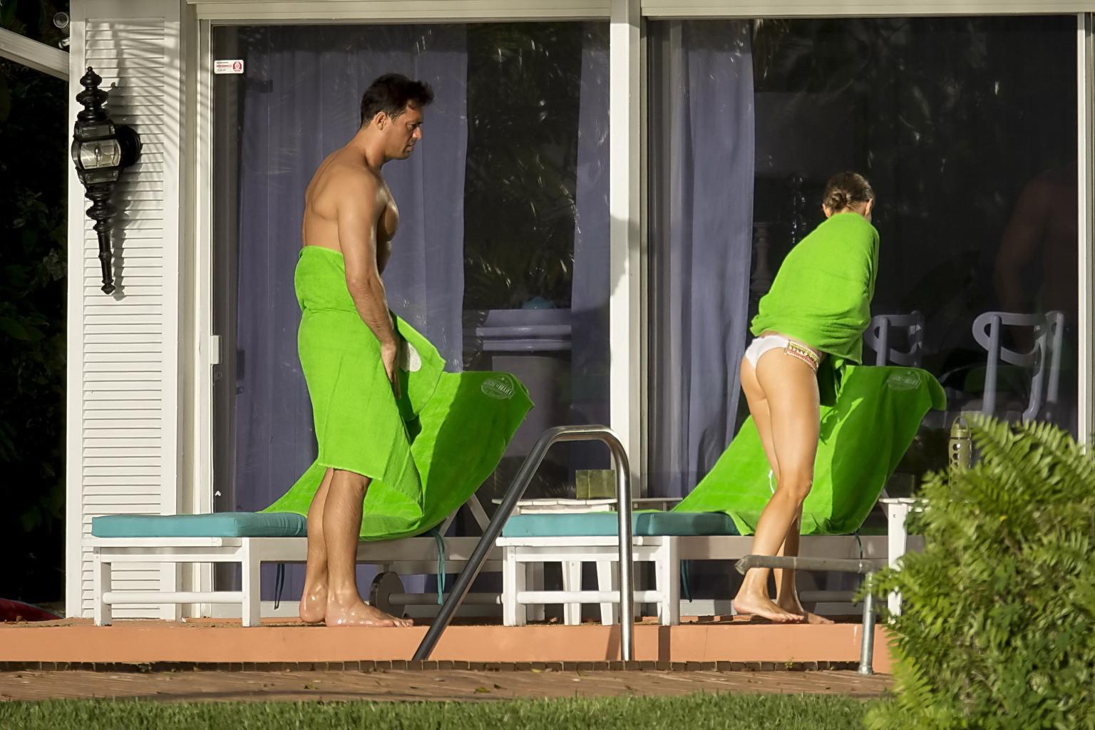 16P Joanna Krupa caught topless at the pool in Miami
