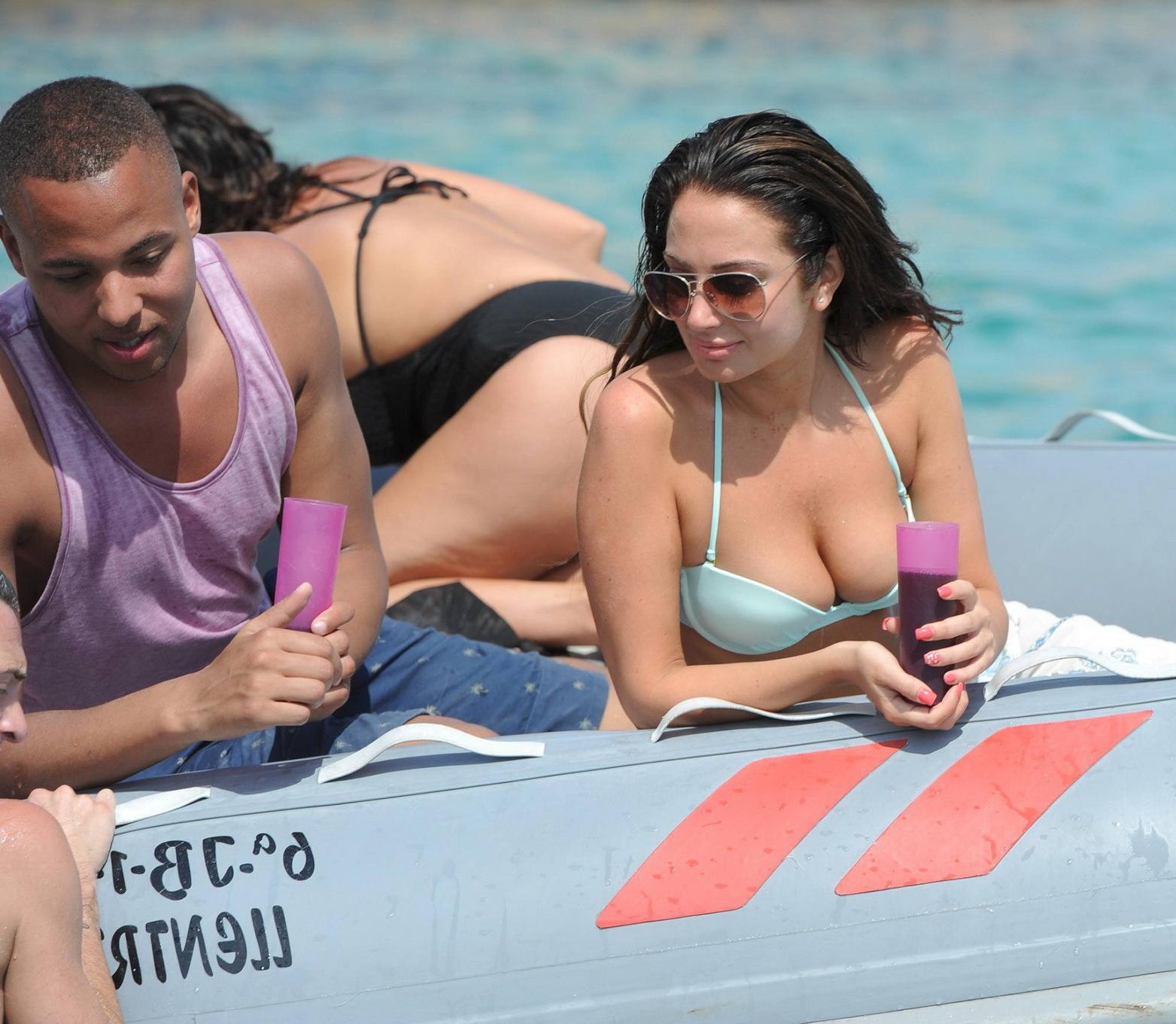 16P Tulisa Contostavlos busting out of her tiny blue bikini at the beach in Ibiza