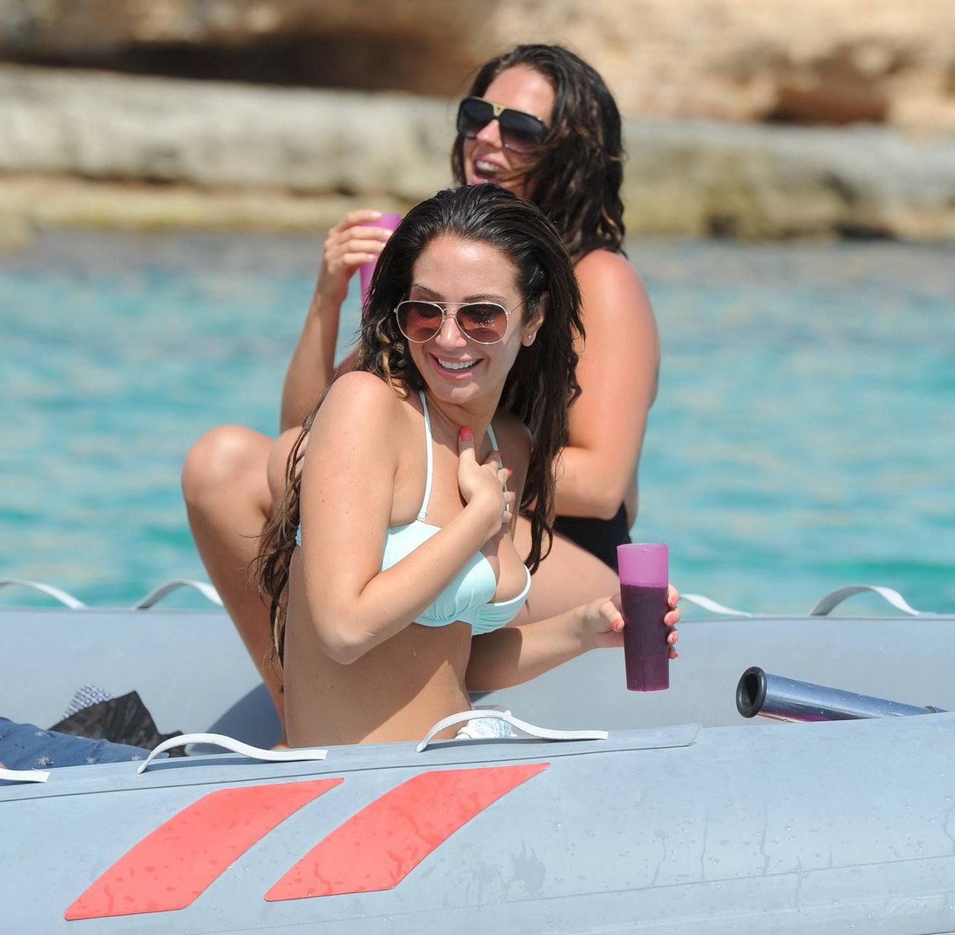 16P Tulisa Contostavlos busting out of her tiny blue bikini at the beach in Ibiza
