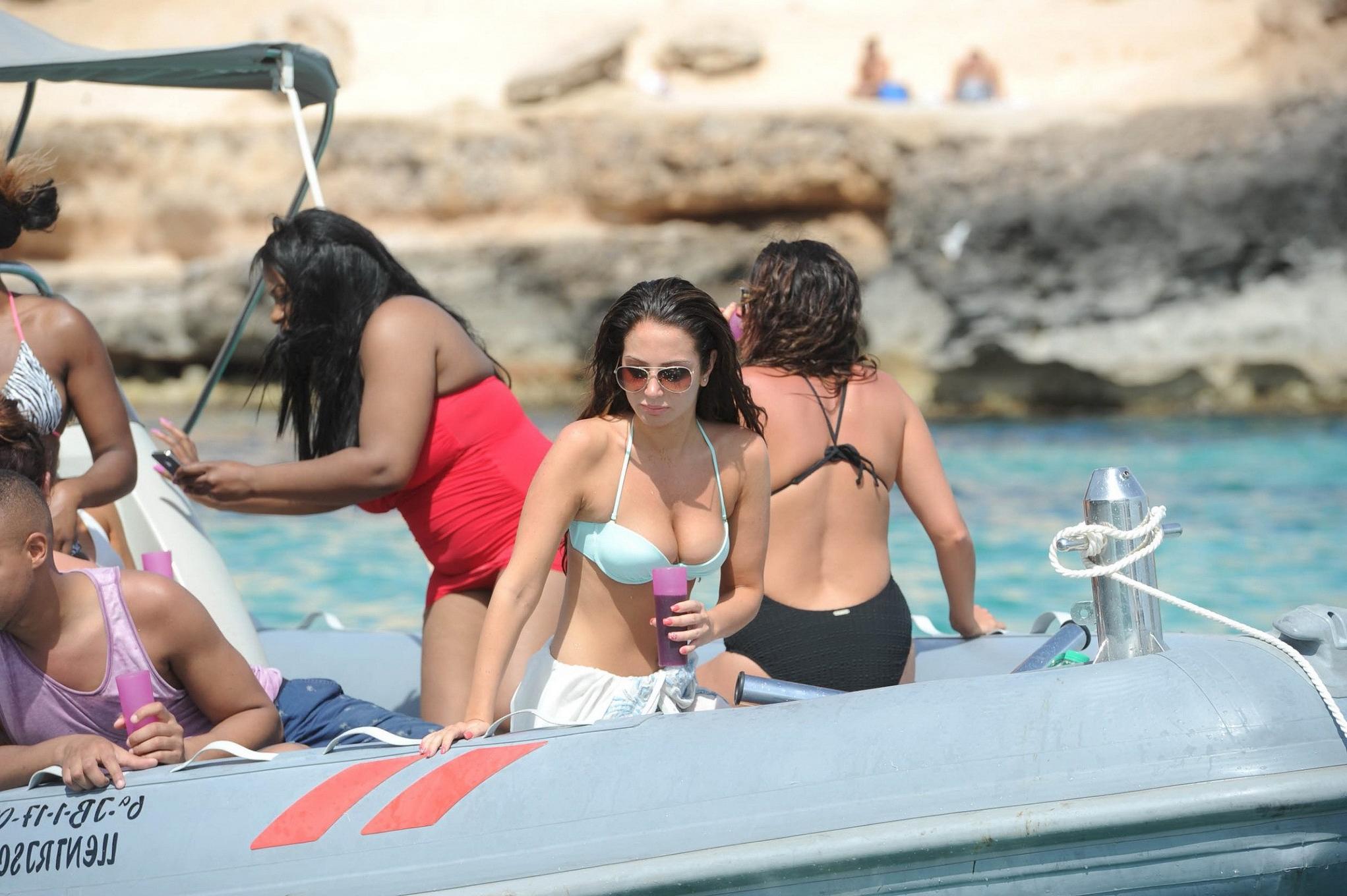 16P Tulisa Contostavlos busting out of her tiny blue bikini at the beach in Ibiza