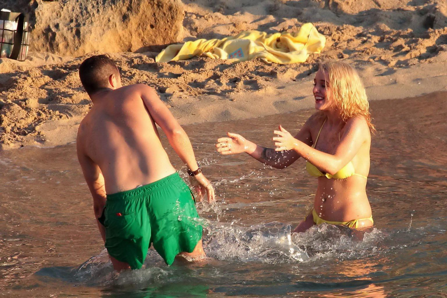 16P Helen Flanagan stripping her skimpy yellow bikini during photoshoot at the beach