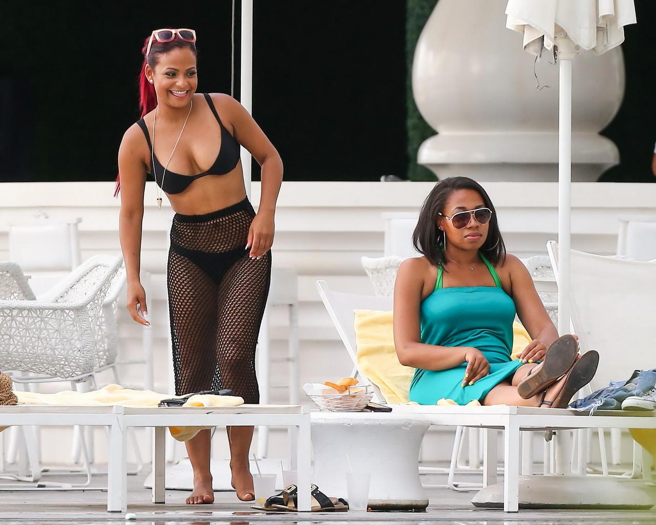 16P Christina Milian smoking hot in tiny black bikini poolside in South Beach