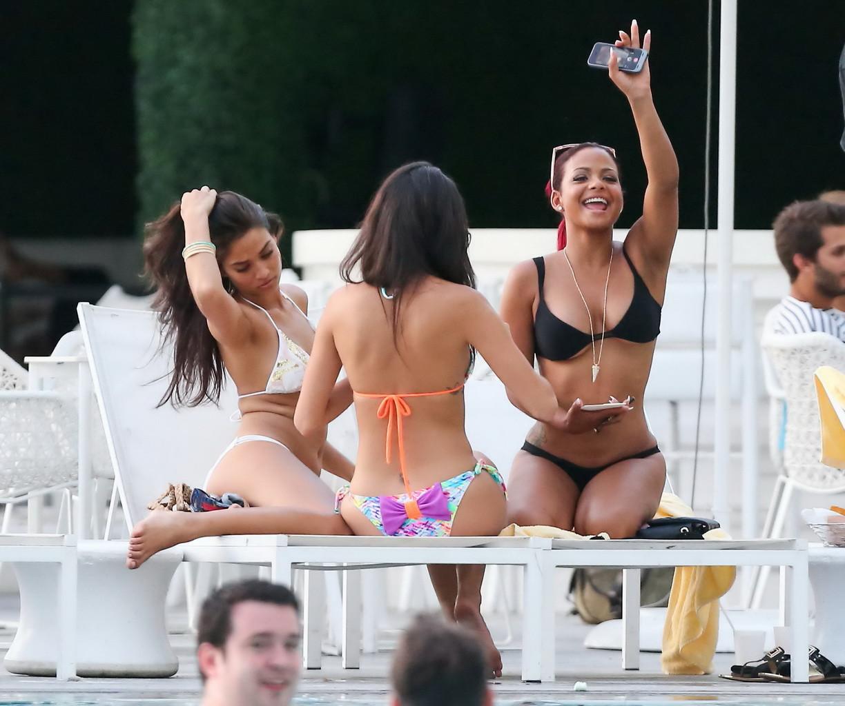 16P Christina Milian smoking hot in tiny black bikini poolside in South Beach